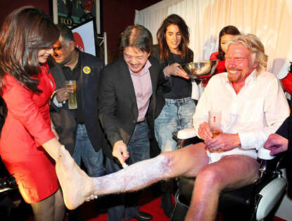 Richard Branson dresses up as AirAsia flight attendant