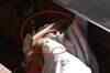 Woman falls under moving train, survives