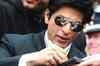 Shah Rukh Khan mobbed at Kuala Lumpur airport