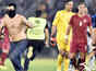 Players, fans fight on pitch
